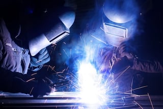 two welders with open arc